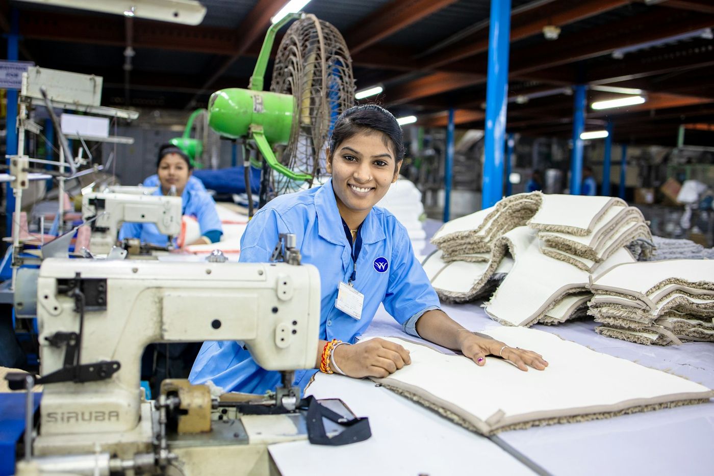 Young woman smiling at her workstation