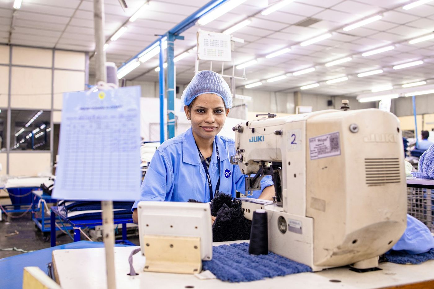 Woman operator at an industrial machine